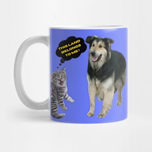 A kitten fighting for land with a dog Mug